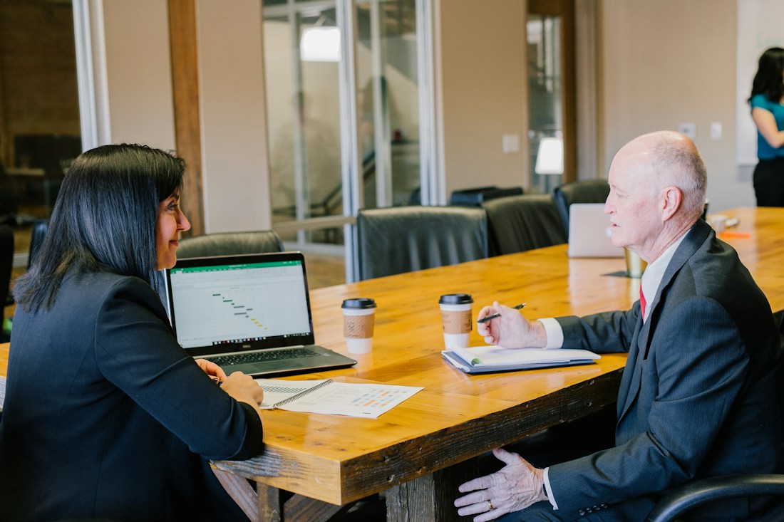 An illustrative business consultation at an office desk